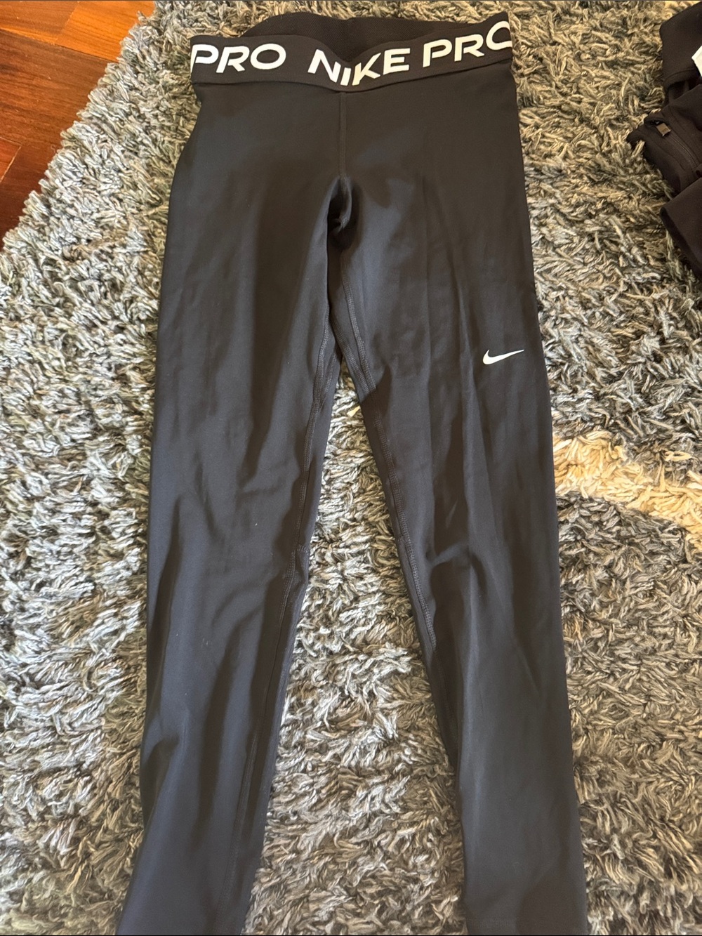Nike Black High-Waist Pro Leggings with White Swoosh